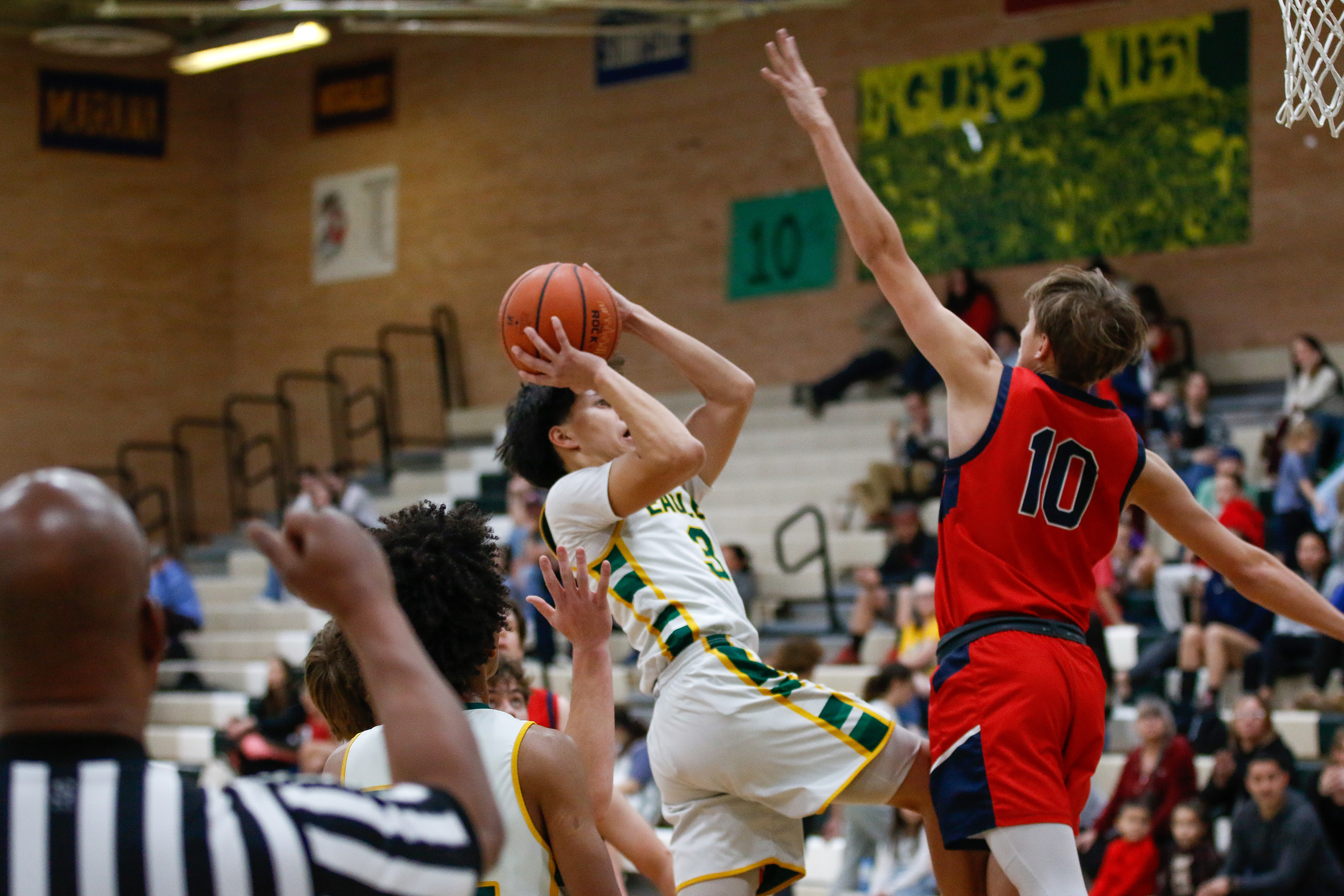 A Santa Rita player dodges one of his opponents to shoot the ball