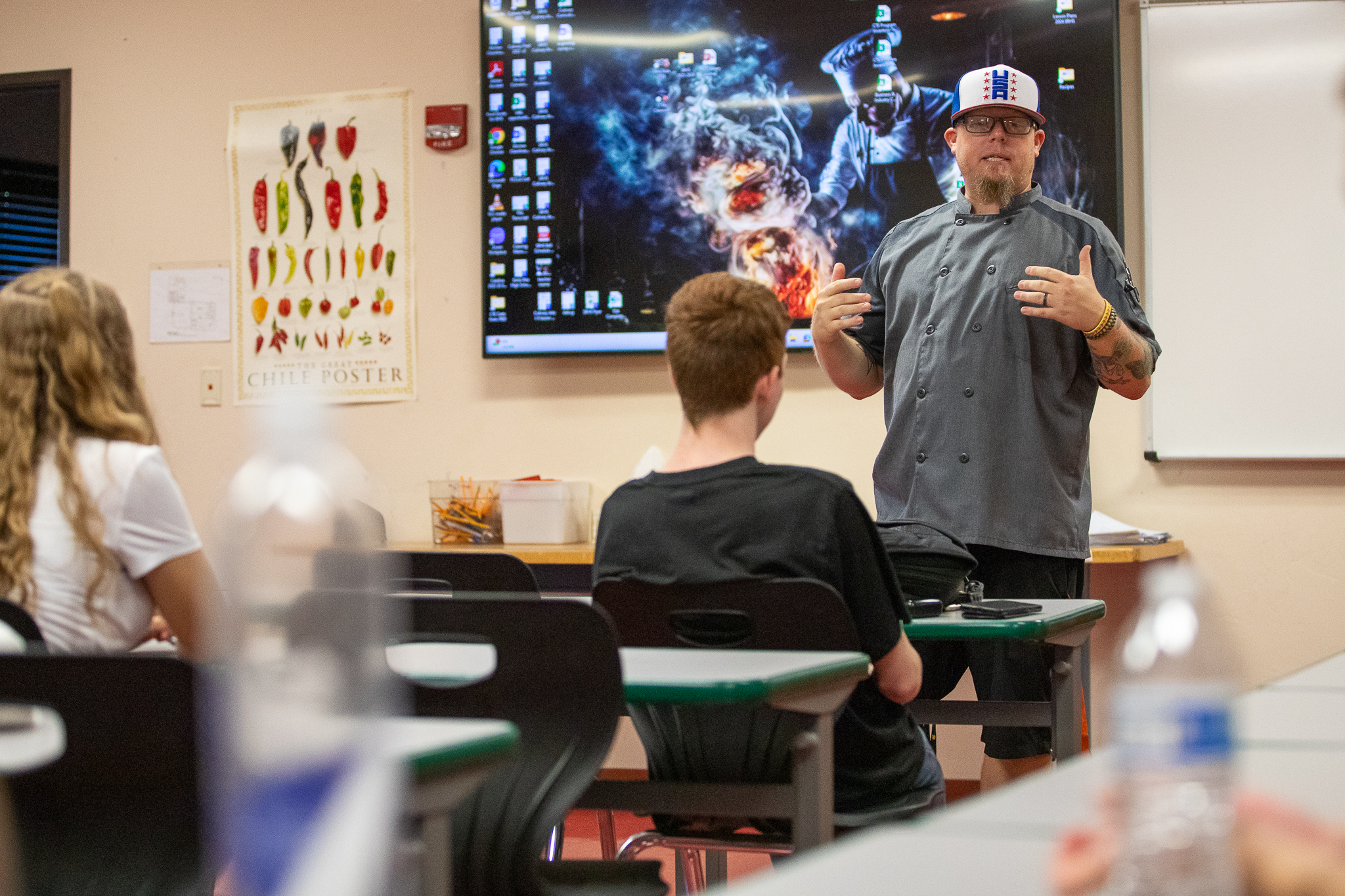 The culinary arts teacher talks to his class on the first day