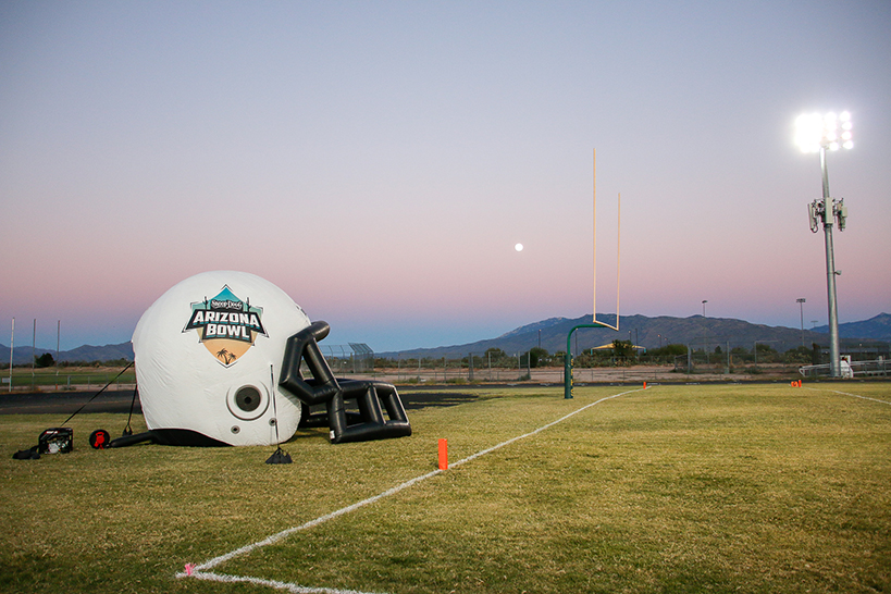 The inflatable helmet on one end of the football field