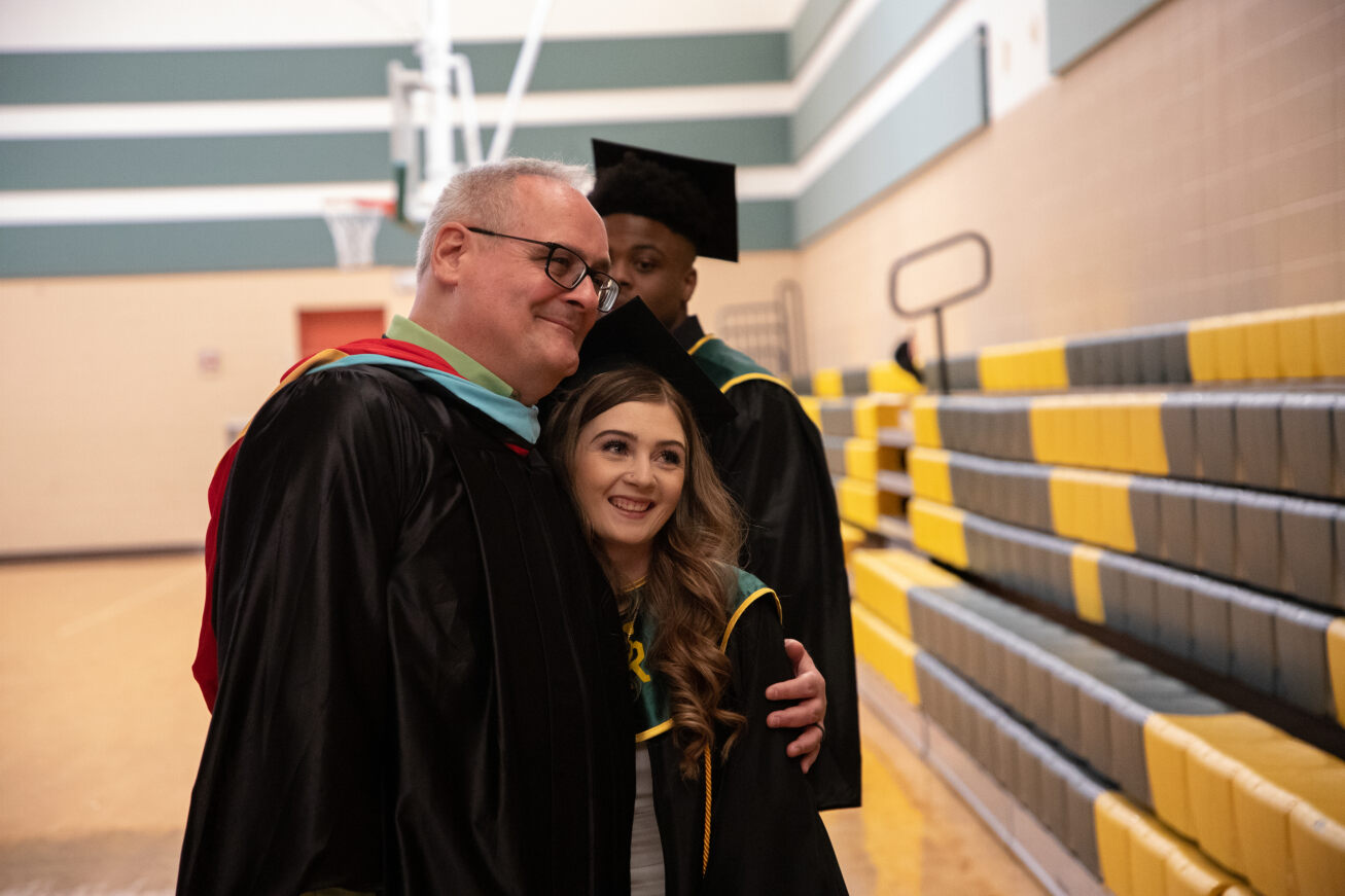 A Santa Rita grad hugs one of her teachers 